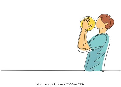 Continuous one line drawing handsome football player kissing ball with pride. Happy expression in national level competition. Professional player. Single line draw design vector graphic illustration