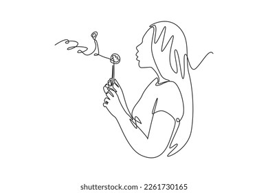 Continuous one line drawing happy beauty woman blowing dandelion flower. Spring concept. Single line draw design vector graphic illustration.