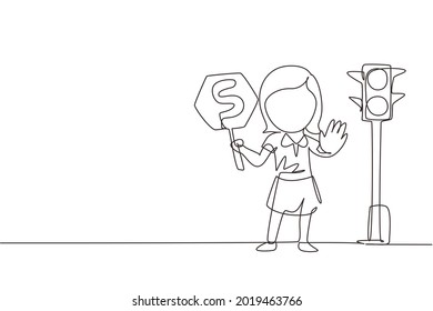 Continuous one line drawing little girl holding stop sign in arm standing near road, pedestrian rules for kids, traffic light in vector style. Child holding stop sign. Single line design illustration