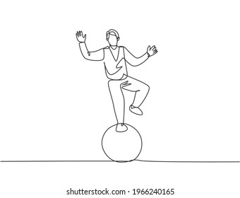 Continuous one line drawing a male acrobat performs a standing stunt with one foot on a circus ball while performing a dance. Interesting for the audience. Single line draw design vector illustration.