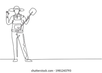 Continuous one line drawing male farmer stood with gesture okay, wearing straw hat and carrying shovel to plant crops on farmland. Success business. Single line draw design vector graphic illustration