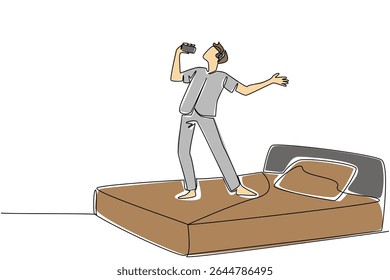 Uma linha contínua desenhando um homem em roupas casuais usam fone de ouvido em uma cama segurar um smartphone usado como um microfone. Passatempo. Música. Dia Nacional da Canção. Ilustração de vetor de design de desenho de linha única