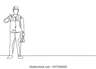 Continuous one line drawing mechanic stands up with a thumbs-up gesture and holding the wrench to perform maintenance on the vehicle engine. Single line draw design vector graphic illustration.