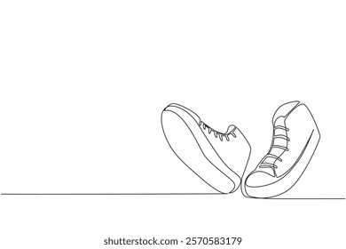 Continuous one line drawing a pair of sneakers like walking. Very comfortable to use for walking or even running. National Two Different Colored Shoes Day. Single line draw design vector illustration