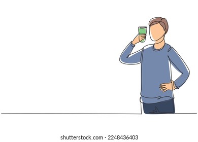 Continuous one line drawing portrait of happy young handsome man holding glass of orange juice. Make him refreshing and enjoyment in summer season. Single line draw design vector graphic illustration