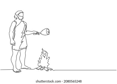 Continuous one line drawing prehistoric man standing and cooking meat on bonfire. Caveman stands and cooking meat food on campfire. Ancient, archaic human. Single line draw design vector illustration