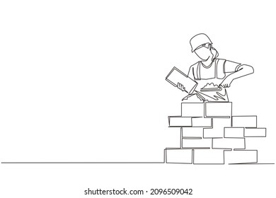 Continuous one line drawing repairwoman building brick wall  Construction worker in uniform   helmet doing work  Builder concept  Repair work services  Single line draw design vector illustration
