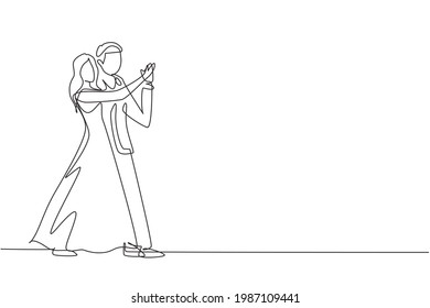 Continuous one line drawing romantic man and woman professional dancer couple dancing tango, waltz dances on dancing contest dancefloor. Happy life. Single line draw design vector graphic illustration