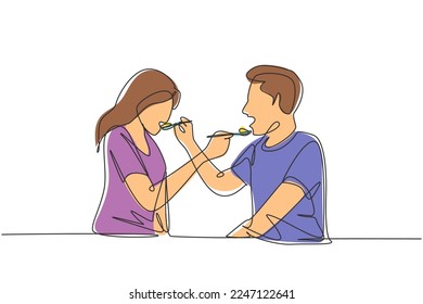 Continuous one line drawing romantic young couple feeding each other. Having fun dinner together at restaurant. Celebrate wedding anniversaries. Single line draw design vector graphic illustration