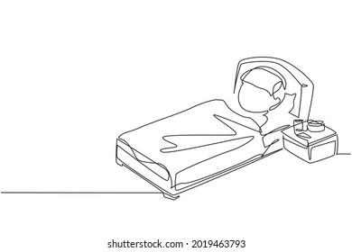 Continuous one line drawing sick boy with high fever. Child is sick with flu or coronavirus. Kid lying in bed feel so bad with fever. Healthcare symbol. Single line design vector graphic illustration