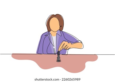 Continuous one line drawing strategy, leadership and management concept. Young cute businesswoman sitting and moving chess figure alone feeling confident. Single line draw design vector illustration