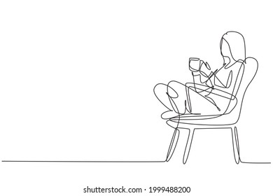 Continuous one line drawing tea time. Relaxed beautiful girl sitting in modern chair, enjoying hot coffee in front of window, side view, free space. Single line draw design vector graphic illustration