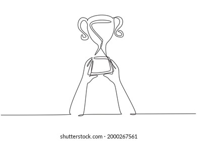 Continuous one line drawing trophy is held by both hands  Symbol winning championships  matches   sports competitions  Best achievement ever  Single line draw design vector graphic illustration