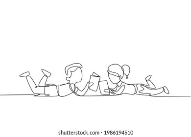 Continuous one line drawing two kids boy and girl reading, learning and laying down on the floor. Study at home. Smart students, education concept. Single line draw design vector graphic illustration