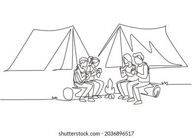 Continuous one line drawing two pair man   woman getting warm near bonfire  Group people camping drinking tea sitting logs   man playing guitar  Single line draw design vector illustration