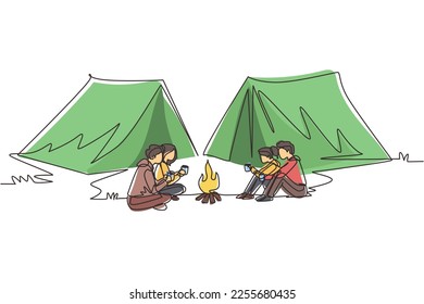 Continuous one line drawing two couple camping around campfire tents. Group of man woman sitting on ground and drinking hot tea getting warm near bonfire. Single line draw design vector illustration