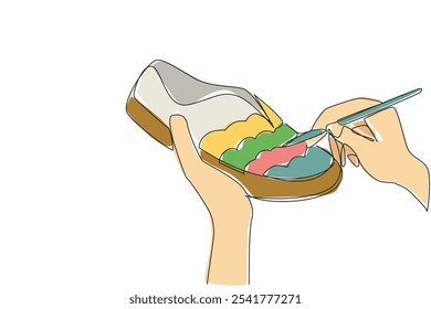 Continuous one line drawing two hands are painting a pattern on the front of shoe using a paint brush. Work that makes money. Art. National Handmade Day. Single line draw design vector illustration