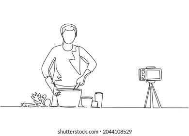 Continuous one line drawing vegan man. Vegetarian food blogger, guy stir and cook vegetable salad. Online culinary school tutorials, foods preparation vlog. Single line draw design vector illustration