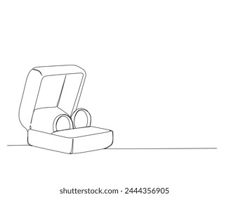 Dibujo continuo de una línea de anillos de matrimonio en la caja. Anillos de boda diseño de un solo contorno. Trazo editable.
