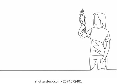 Continuous one line drawing white cockatiel bird perched on hand of woman. The bird that can be kept as a pet comes from Australia. Woman Holding Bird. Single line draw design vector illustration