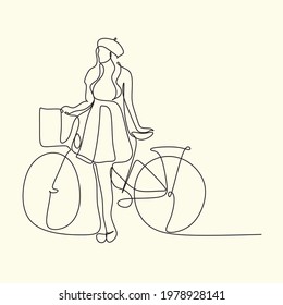 Continuous one line drawing woman girl on a bicycle