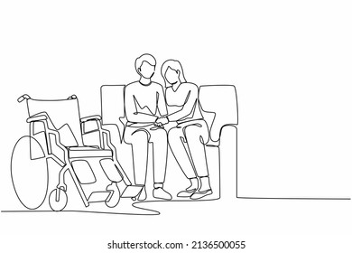 Continuous one line drawing woman comforting injured disabled husband tell diagnosis help with disability problem talk, holding hands with wheelchair at home. Single line draw design vector graphic