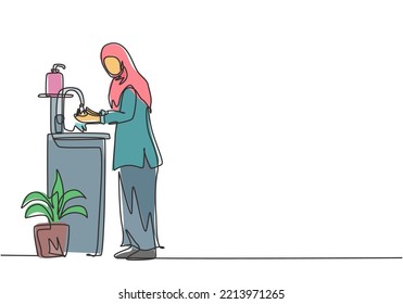 Continuous one line drawing a woman in a hijab washes her hands in the sink, there is a soap dish near the faucet and pot of plants under the sink. Single line draw design vector graphic illustration.