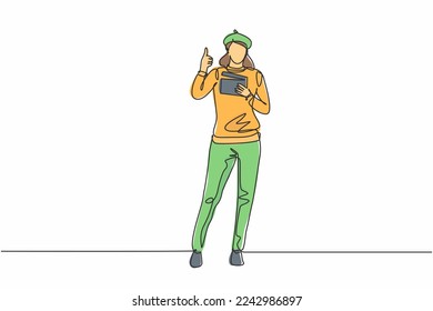 Continuous one line drawing woman film director stands with a thumbs-up gesture while holding the clapperboard to prepare camera crew for shooting. Single line draw design vector graphic illustration