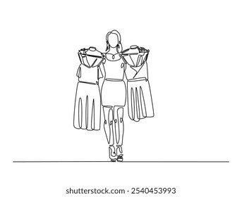 Continuous one line drawing of woman holding clothes on hangers. Shop assistant holding hangers with clothes single line draw vector illustration. Editable vector. 
