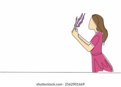 Continuous one line drawing a woman smells the lavender flower she is holding. The scent is soft and very calming. Freshness. National Sense Of Smell Day. Single line draw design vector illustration