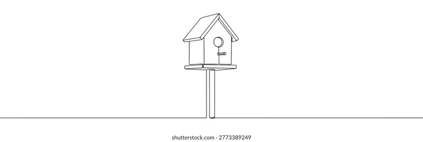 Continuous one line drawing of a wooden birdhouse on a pole for garden decoration