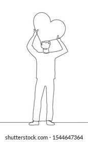 continuous one line drawing a young man stands in full growth and holds a large flat heart above his head. The concept of declaration of love, kindness, warmth. It can be used for animation. Vector