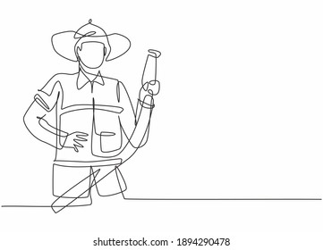 Continuous one line drawing of young male firefighter holding water nozzle. Professional job profession minimalist concept. Single line draw design vector graphic illustration