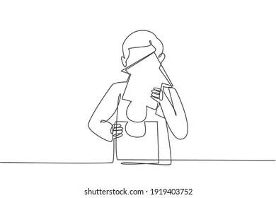 Continuous one line drawing of young handsome male worker arrange puzzle piece into building. Success business manager minimalist concept. Trendy single line draw design vector graphic illustration