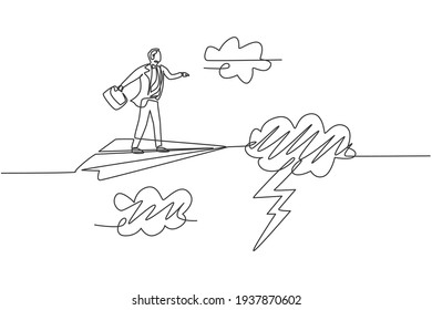 Continuous one line drawing young male worker flying with paper airplane through heavy thunderstorm. Business obstacle metaphor. Minimalist concept. Single line draw design vector graphic illustration