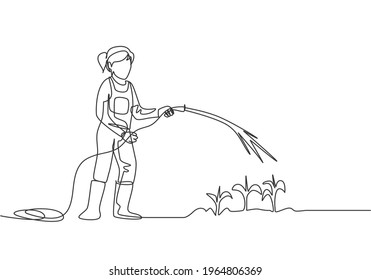 Continuous one line drawing young female farmer standing on farm field while watering the plants using a hose. Farmer planting activities concept. Single line draw design vector graphic illustration.