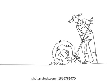 Continuous one line drawing young male farmer was stabbing a haystack and rolling it up with a straw stick. Successful farming minimalist concept. Single line draw design vector graphic illustration.