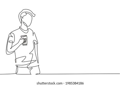 Continuous one line drawing young man holding a cup of coffee while thinking about tomorrow's work plans. Success and relaxing lifestyle concept. Single line draw design vector graphic illustration