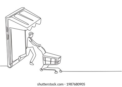 Continuous one line drawing young man coming out of canopy smartphone screen pushing a shopping cart. Sale, digital lifestyle, consumerism concept. Single line draw design vector graphic illustration