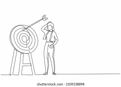 Continuous one line drawing young ambition businesswoman arrow missed at the target. Failed hit archery target. Business challenge failure metaphor. Single line draw design vector graphic illustration