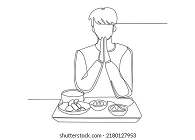 Continuous one line drawing young boy praying before eating. Eating activity concept. Single line draw design vector graphic illustration.
