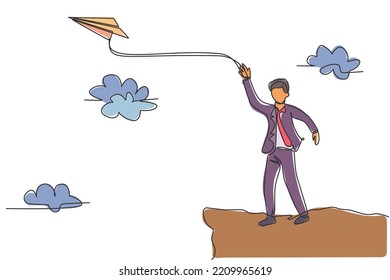 Continuous one line drawing of young male worker flies paper aircraft into the sky. Success business manager metaphor. Minimalist concept. Trendy single line draw design vector graphic illustration