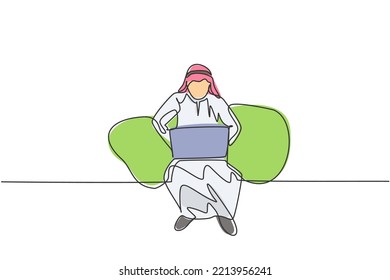 Continuous one line drawing young Arab male worker sitting on sofa while typing business proposal on laptop. Manager preparing work concept. Single line draw design vector graphic illustration.