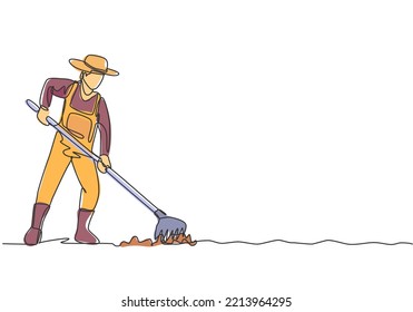 Continuous one line drawing young male farmer leveling the ground using a rake. Start a new planting season. Successful farming minimalist concept. Single line draw design vector graphic illustration.