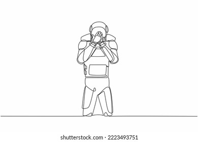 Continuous one line drawing young astronaut standing with covering mouth with hands, shocked with shame for mistake. Cosmonaut outer space concept. Single line draw graphic design vector illustration