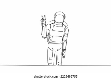 Continuous one line drawing young astronaut standing with v symbol, victory sign, success or winner gesture in moon surface. Cosmonaut outer space. Single line draw graphic design vector illustration