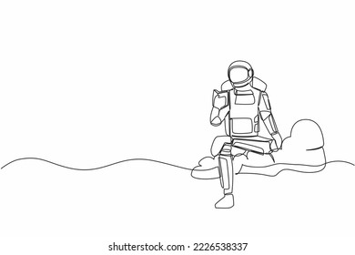 Continuous one line drawing young astronaut sitting on cloud reading book. Study literature or research in wormhole exploration. Cosmonaut outer space. Single line graphic design vector illustration