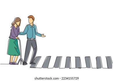 Continuous one line drawing a young man helps an old grandmother who uses a cane to cross the road on the zebra crossing. Good attitude on the road. Single line draw design vector graphic illustration