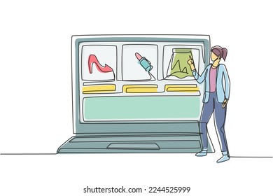 Continuous one line drawing young woman choosing shopping items on a giant laptop screen. Digital lifestyle with internet and gadgets concept. Single line draw design vector graphic illustration