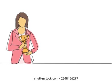 Continuous one line drawing young businesswoman wearing blazer holding golden trophy with both hands. Symbol of achievement business performance. Single line draw design vector graphic illustration
